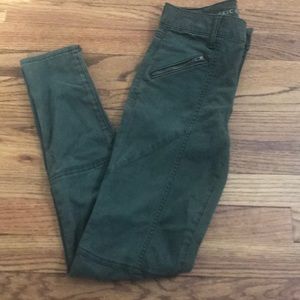 Green pants with zippers